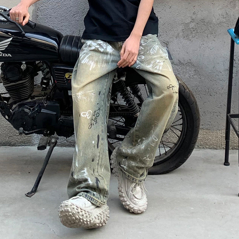Streetwear style baggy graffiti jeans and chunky sneakers, Vaezion Shop, urban motorcycle backdrop