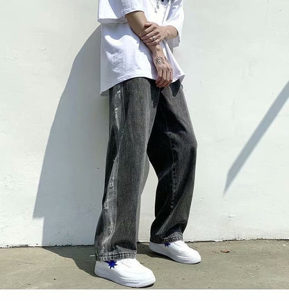 Streetwear style: man in oversized white shirt, baggy black jeans, and white sneakers, Vaezion Shop