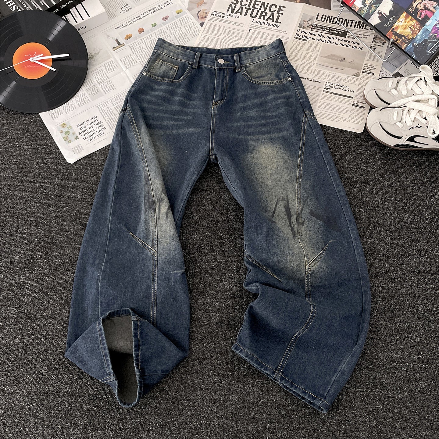 Vaezion Shop men's wide leg streetwear jeans with faded wash, styled with sneakers and vinyl record