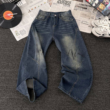 Vaezion Shop men's wide leg streetwear jeans with faded wash, styled with sneakers and vinyl record